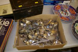 Ebonized wooden box and a quantity of loose flatware