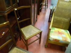 Cane backed armchair and two other cane seated chairs