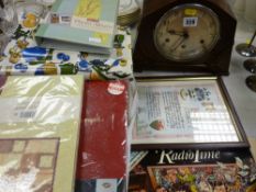 Polished mantel clock and mixed household items