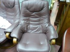 Burgundy coloured leather effect swivel armchair