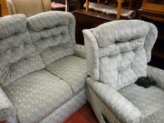 Compact two seater green coloured sofa with matching electric reclining armchair E/T
