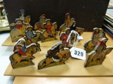 Two boards of six wooden Canterbury Tales characters