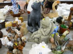 Large conch shell and two heavy garden ornaments