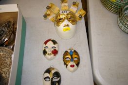 Four decorative miniature masquerade masks