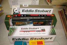 Two boxed Eddie Stobart diecast vehicles and a boxed reproduction Dinky Toys Mini Traveller