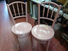 Two pink painted bentwood chairs