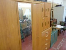 Suite of wood effect bedroom furniture comprising wardrobe, chest of five long drawers and two