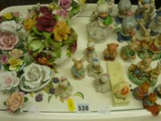 Parcel of ornamental items including posies, rabbit figurines etc