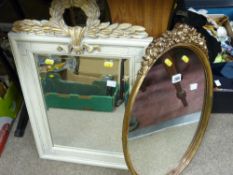 Two ornately decorated wall mirrors