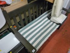 Solid looking timber garden bench with cushion