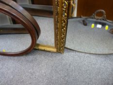 Gilt framed wall mirror, an oval metal framed bevelled mirror and one other