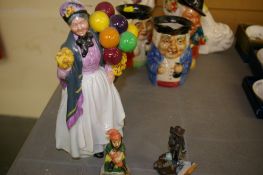 Royal Doulton figurine 'Biddy Penny Farthing' HN1843 and two other figurines, one metallic titled '