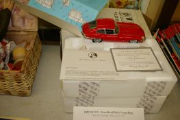 Franklin Mint boxed red coloured scale model of an E-Type Jaguar with certificate