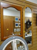 Two wooden framed wall mirrors