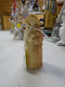 A Royal Worcester blush porcelain nun candle snuffer