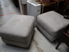 Two grey suede storage footstools