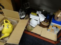 A crate of various kitchen items including a boxed yellow pottery teaset, moulds etc