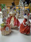 A Royal Doulton figurine - 'Southern Belle' HN2229 together with two others - 'Christmas Morn'