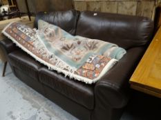 A modern chocolate brown leather two-seater sofa