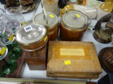 Two polished biscuit barrels, a similar preserve pot & two cased sets of weights etc