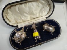 A cased three-piece silver condiment set