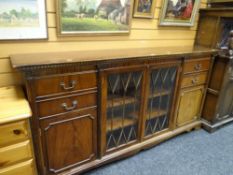 A shallow reproduction mahogany bookcase with centre glazed doors