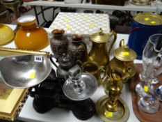 A basket of dolls & a parcel of metalware, set of scales etc