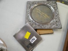 A twentieth century silver easel portrait mirror together with a silver machine turned cigarette