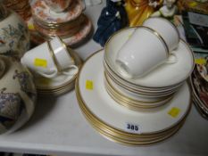 A parcel of Royal Doulton 'Gold Concord' including teacups, saucers, bowls, dinner plates