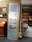 A three sliding door freestanding wardrobe with fixings