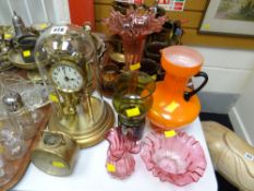 A glass dome rotary clock & a drum-style table clock