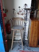 A pine spindle back tall stool together with two metal candle stands