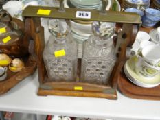 A vintage oak two-bottle tantalus