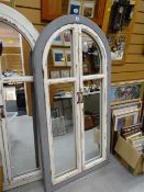 A painted wooden framed arch wall mirror