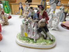 A Continental porcelain model of three figures
