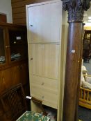 An IKEA tall cupboard unit with two drawers & open base