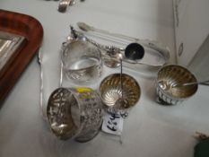 A pair of silver salts of fluted bowl form raised on three bun feet together with a pair of silver