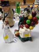 A Royal Doulton figurine - 'The Old Balloon Seller' HN1315 together with a Royal Doulton