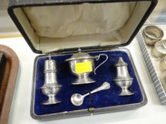 A cased three-piece silver condiment set