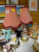 A pair of continental-style pottery figural table lamps & shades E/T