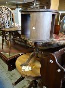 A vintage revolving circular drum shaped library table together with a circular side table with
