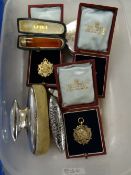 A parcel of silver / part-silver items including three cased Royal North Devon golf club medals,