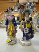 A pair of Continental porcelain Regency-style figures