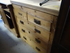 A stripped pine chest of drawers, two short above three long