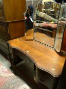Vintage polished wood concave front dressing table with a tri-fold mirror