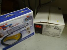 A boxed overhead projector & an Autocleaner floor vac