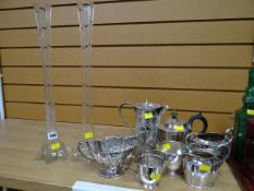 Three-piece EPNS tea set, EPNS water jug, lily vases etc