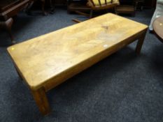 A marquetry top long-John coffee table
