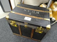 A turn of the century French canvas cabin steamer trunk with brass fittings, wooden banding & havin
