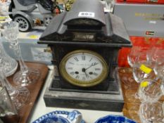 An antique architectural slate mantel clock